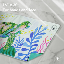 Load image into Gallery viewer, Eco-friendly MAGWAI quick-drying microfiber hand towel made from recycled plastic bottles, featuring the sea turtle-inspired design; compact, soft, and ideal for travel, gym, or daily use